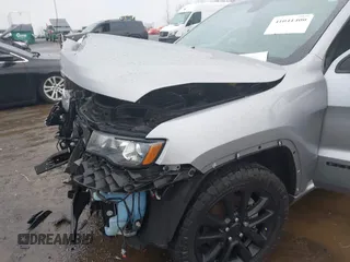 2021 Jeep Grand Cherokee Laredo E with VIN 1C4RJEAG6MC713910, listed as a IAAI auction lot 41041400 with 69,242 mi miles and . Bid and sale history available at DreamBid. Image 17.