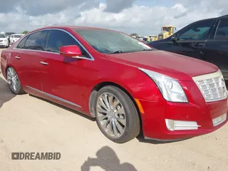 2013 Cadillac XTS Premium z VIN 2G61S5S38D9113048, wystawiony jako IAAI lot #42423561 z przebiegiem 142 727 mil mil oraz . Historia ofert i sprzedaży dostępna na DreamBid. Obrazek 1.