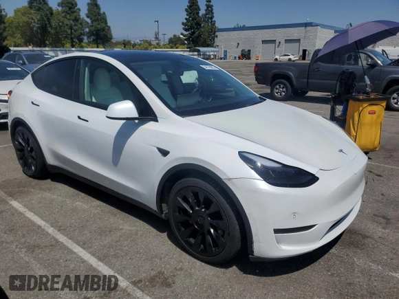 2022 Tesla Model Y Performance with VIN 7SAYGDEFXNF407340, listed as a Copart auction lot 54376895 with 56,709 mi miles and Salvage Title. Bid and sale history available at DreamBid. Image 4.