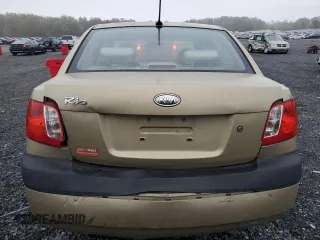 2009 Kia Rio LX with VIN KNADE223096485561, listed as a Copart auction lot 73412874 with 137,858 mi miles and Salvage Title. Bid and sale history available at DreamBid. Image 6.