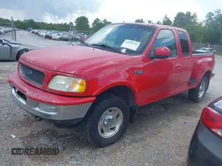 1997 Ford F-150 with VIN 1FTDX08W2VKC17809, listed as a IAAI auction lot 42541525 with 143,963 mi miles and . Bid and sale history available at DreamBid. Image 2.