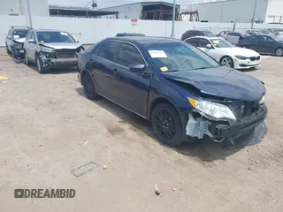 2014 Toyota Camry L with VIN 4T4BF1FK5ER389872, listed as a IAAI auction lot 42022376 with 83,870 mi miles and . Bid and sale history available at DreamBid. Image 1.