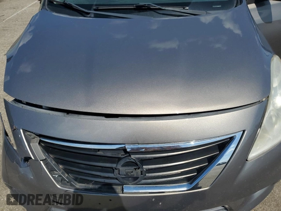 2012 Nissan Versa SV with VIN 3N1CN7AP7CL930619, listed as a Copart auction lot 63657855 with 106,911 mi miles and Salvage title. Bid and sale history available at DreamBid. Image 11.