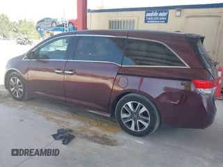 2014 Honda Odyssey Touring with VIN 5FNRL5H90EB080889, listed as a IAAI auction lot 42085305 with 123,286 mi miles and . Bid and sale history available at carsss.com. Image 14.