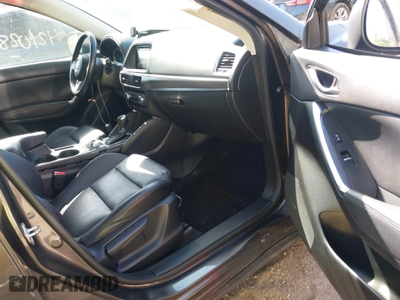 2016 Mazda CX-5 Grand Touring z VIN JM3KE4DY8G0846265, wystawiony jako IAAI lot #42102843 z przebiegiem 159 827 mil mil oraz . Historia ofert i sprzedaży dostępna na DreamBid. Obrazek 5.