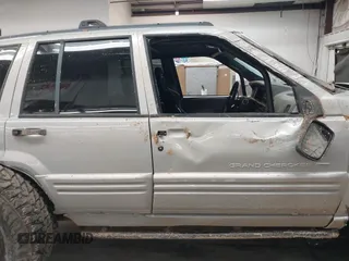 1998 Jeep Grand Cherokee Laredo with VIN 1J4GZ48Y9WC206957, listed as a IAAI auction lot 41848433 with 122,104 mi miles. Bid and sale history available at carsss.com. Image 13.