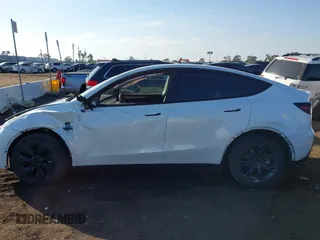 2024 Tesla Model Y Long Range with VIN 7SAYGDEE0RF209847, listed as a IAAI auction lot 41447620 with 7,646 mi miles and . Bid and sale history available at DreamBid. Image 14.