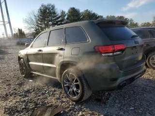 2021 Jeep Grand Cherokee SRT with VIN 1C4RJFDJ5MC718125, listed as a Copart auction lot 88736945 with 54,553 mi miles and Salvage Title. Bid and sale history available at carsss.com. Image 2.