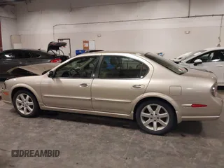 2002 Nissan Maxima GLE z VIN JN1DA31AX2T305310, wystawiony jako IAAI lot #42302521 z przebiegiem 68 920 mil mil oraz . Historia ofert i sprzedaży dostępna na DreamBid. Obrazek 14.