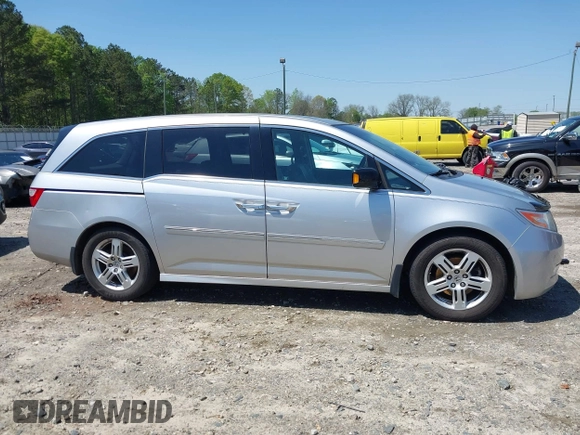 2012 Honda Odyssey Touring with VIN 5FNRL5H96CB043939, listed as a IAAI auction lot 41983643 with 202,535 mi miles. Bid and sale history available at carsss.com. Image 14.