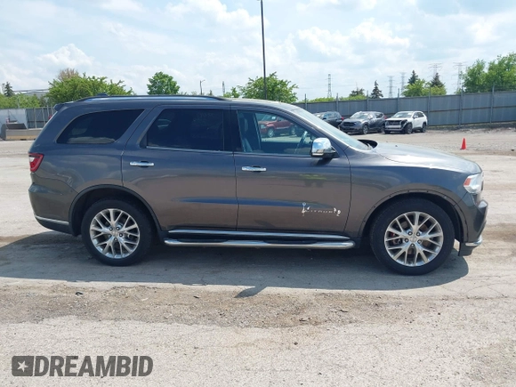 2014 Dodge Durango Citadel with VIN 1C4RDJEG0EC978611, listed as a IAAI auction lot 42250344 with 200,412 mi miles and . Bid and sale history available at DreamBid. Image 14.