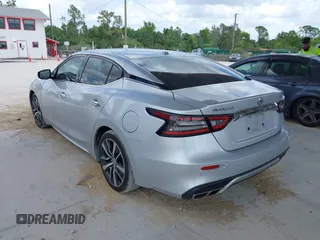 2020 Nissan Maxima SV z VIN 1N4AA6CV6LC366887, wystawiony jako IAAI lot #41952159 z przebiegiem 100 182 mil mil oraz . Historia ofert i sprzedaży dostępna na DreamBid. Obrazek 3.