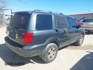 2004 Honda Pilot EX with VIN 2HKYF18574H532409, listed as a IAAI auction lot 41701760 with 302,949 mi miles and . Bid and sale history available at carsss.com. Image 4.