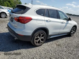 2018 BMW X1 sDrive28i with VIN WBXHU7C32J5L07666, listed as a Copart auction lot 54173465 with 132,514 mi miles and Clean Title. Bid and sale history available at DreamBid. Image 3.