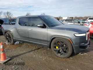 2022 Rivian R1T Adventure Package with VIN 7FCTGAAAXNN005667, listed as a Copart auction lot 44321435 with 48,249 mi miles and Salvage Title. Bid and sale history available at carsss.com. Image 4.