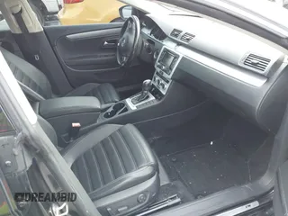 2014 Volkswagen CC R-Line with VIN WVWBN7ANXEE521055, listed as a IAAI auction lot 41197539 with 94,902 mi miles. Bid and sale history available at carsss.com. Image 5.