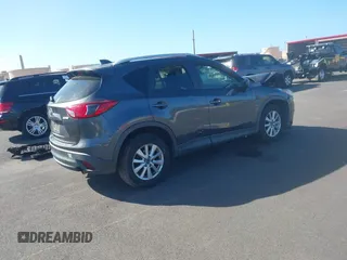 2014 Mazda CX-5 Sport with VIN JM3KE2BE4E0414721, listed as a IAAI auction lot 41408914 with Not Provided miles and . Bid and sale history available at carsss.com. Image 4.