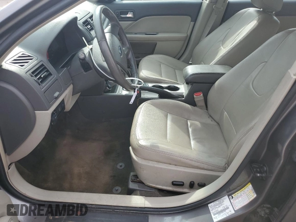 2012 Ford Fusion Hybrid z VIN 3FADP0L33CR211609, wystawiony jako Copart lot #60873005 z przebiegiem 144 474 mil mil oraz Szkoda całkowita • Salvage title. Historia ofert i sprzedaży dostępna na DreamBid. Obrazek 7.