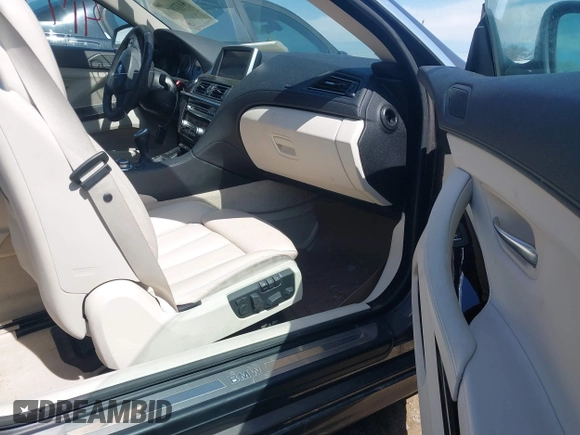 2012 BMW 6 Series 650i z VIN WBALX3C57CC528832, wystawiony jako IAAI lot #41779268 z przebiegiem 75 119 mil mil oraz . Historia ofert i sprzedaży dostępna na DreamBid. Obrazek 5.