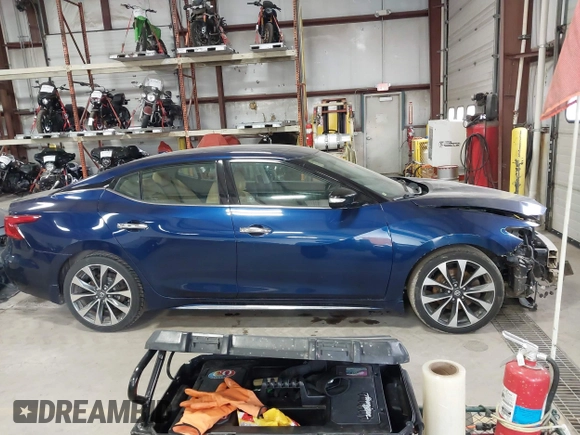 2016 Nissan Maxima SL with VIN 1N4AA6AP6GC425575, listed as a IAAI auction lot 41463093 with 135,920 mi miles and . Bid and sale history available at DreamBid. Image 13.