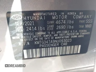 2022 Genesis G70 2.0T with VIN KMTG34TA9NU093023, listed as a IAAI auction lot 40989282 with 50,036 mi miles. Bid and sale history available at carsss.com. Image 9.