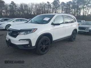 2022 Honda Pilot Special Edition with VIN 5FNYF6H23NB082020, listed as a IAAI auction lot 41263792 with 61,061 mi miles. Bid and sale history available at carsss.com. Image 2.
