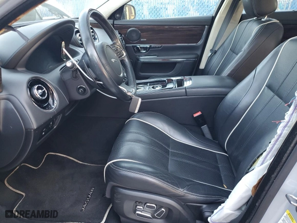 2015 Jaguar XJ with VIN SAJWJ2GD9F8V81151, listed as a Copart auction lot 45724765 with 77,392 mi miles and Salvage Title. Bid and sale history available at carsss.com. Image 7.