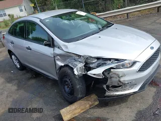 2017 Ford Focus S z VIN 1FADP3E21HL241557, wystawiony jako IAAI lot #42100036 z przebiegiem 106 764 mil mil oraz . Historia ofert i sprzedaży dostępna na DreamBid. Obrazek 1.