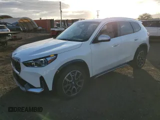 2023 BMW X1 xDrive28i with VIN WBX73EF01P5X59167, listed as a Copart auction lot 84768734 with 5,925 mi miles and Salvage title. Bid and sale history available at DreamBid. Image 1.