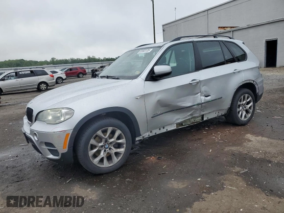 2012 BMW X5 35i with VIN 5UXZV4C57CL747717, listed as a Copart auction lot 63003135 with 135,999 mi miles and Clean title. Bid and sale history available at DreamBid. Image 1.