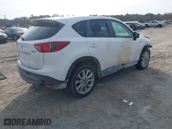 2014 Mazda CX-5 Grand Touring with VIN JM3KE4DY0E0343777, listed as a IAAI auction lot 41464395 with 126,214 mi miles. Bid and sale history available at carsss.com. Image 4.