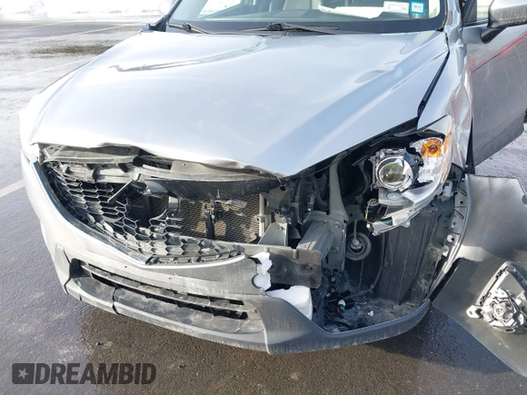 2014 Mazda CX-5 Grand Touring with VIN JM3KE2DY8E0304911, listed as a IAAI auction lot 41672197 with 77,523 mi miles. Bid and sale history available at carsss.com. Image 6.