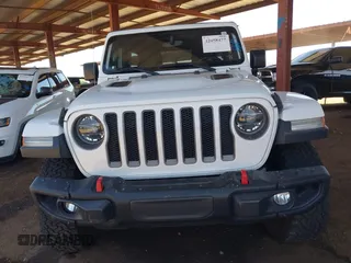 2020 Jeep Wrangler Unlimited Rubicon with VIN 1C4HJXFGXLW107958, listed as a IAAI auction lot 42058477 with 69,951 mi miles and . Bid and sale history available at DreamBid. Image 12.