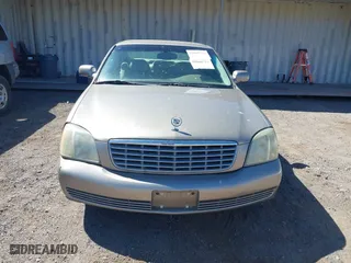 2003 Cadillac DeVille with VIN 1G6KD54Y43U136688, listed as a IAAI auction lot 41860719 with 124,230 mi miles. Bid and sale history available at carsss.com. Image 6.
