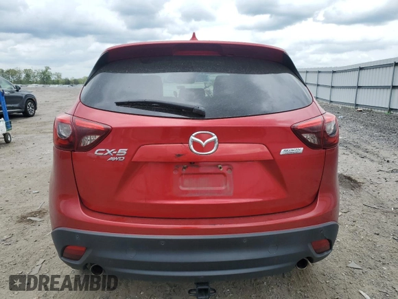 2016 Mazda CX-5 Grand Touring with VIN JM3KE4DY0G0664379, listed as a Copart auction lot 54659005 with 116,022 mi miles and Salvage Title. Bid and sale history available at DreamBid. Image 6.