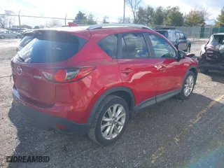 2014 Mazda CX-5 Grand Touring with VIN JM3KE2DY8E0373064, listed as a IAAI auction lot 41683791 with 186,970 mi miles. Bid and sale history available at carsss.com. Image 4.