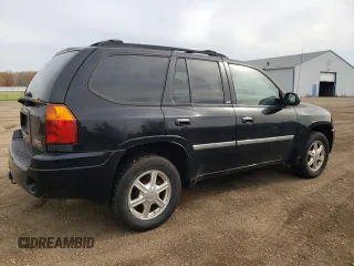2007 GMC Envoy SLT with VIN 1GKDT13S972197393, listed as a Copart auction lot 77958764 with 151,586 mi miles and Salvage Title. Bid and sale history available at DreamBid. Image 3.