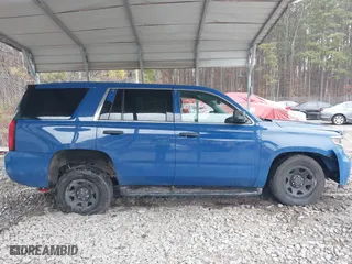 2015 Chevrolet Tahoe Commercial with VIN 1GNSK2EC1FR663199, listed as a IAAI auction lot 41552787 with 148,187 mi miles. Bid and sale history available at carsss.com. Image 13.