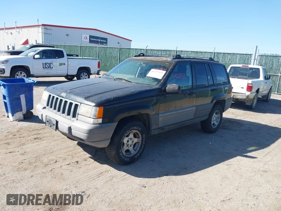 1997 Jeep Grand Cherokee Laredo with VIN 1J4GZ58S4VC633205, listed as a IAAI auction lot 41727571 with 201,228 mi miles. Bid and sale history available at carsss.com. Image 2.