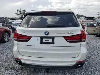 2015 BMW X5 xDrive35i z VIN 5UXKR0C58F0P03231, wystawiony jako Copart lot #60964305 z przebiegiem 71 419 mil mil oraz Szkoda całkowita • Salvage title. Historia ofert i sprzedaży dostępna na DreamBid. Obrazek 6.