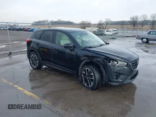 2016 Mazda CX-5 Grand Touring with VIN JM3KE4DY3G0769448, listed as a IAAI auction lot 41947725 with 154,051 mi miles and . Bid and sale history available at carsss.com. Image 1.