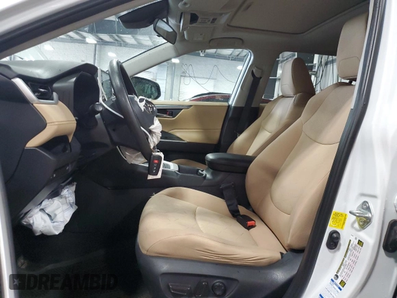 2019 Toyota RAV4 Hybrid XLE with VIN 2T3RWRFV1KW016526, listed as a Copart auction lot 61466435 with 64,255 mi miles and Salvage title. Bid and sale history available at DreamBid. Image 7.