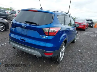 2018 Ford Escape Titanium with VIN 1FMCU0J97JUD34272, listed as a IAAI auction lot 42078237 with 87,783 mi miles and . Bid and sale history available at DreamBid. Image 4.