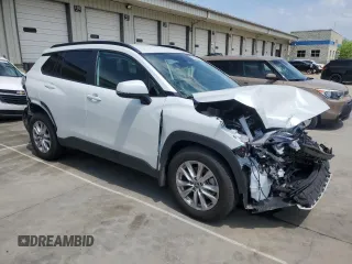 2023 Toyota Corolla Cross LE with VIN 7MUCAAAG2PV053730, listed as a Copart auction lot 54825035 with 33,313 mi miles and Salvage title. Bid and sale history available at DreamBid. Image 4.
