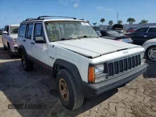 1993 Jeep Cherokee Sport with VIN 1J4FJ68S4PL555701, listed as a Copart auction lot 76020714 with 130,884 mi miles and Salvage Title. Bid and sale history available at carsss.com. Image 4.