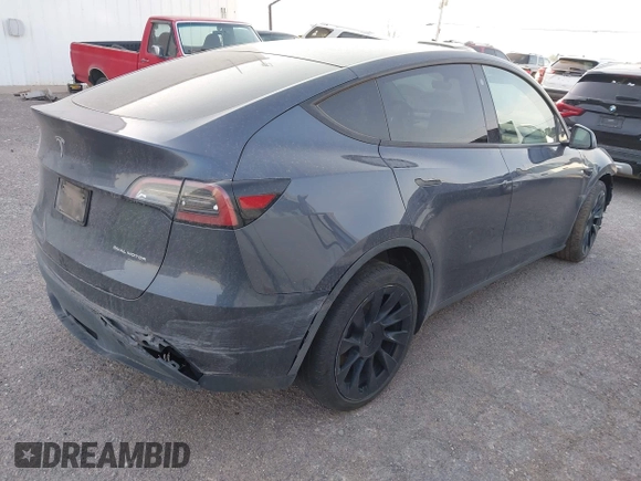 2023 Tesla Model Y Long Range with VIN 7SAYGDEE1PA053683, listed as a IAAI auction lot 42124517 with 32,295 mi miles. Bid and sale history available at carsss.com. Image 4.