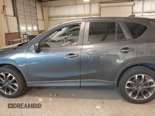 2016 Mazda CX-5 Grand Touring with VIN JM3KE2DYXG0846787, listed as a IAAI auction lot 41346364 with 113,553 mi miles. Bid and sale history available at carsss.com. Image 14.