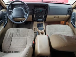 2001 Jeep Cherokee Sport with VIN 1J4FT48S41L570480, listed as a Copart auction lot 56123925 with 216,338 mi miles and Salvage title. Bid and sale history available at DreamBid. Image 8.