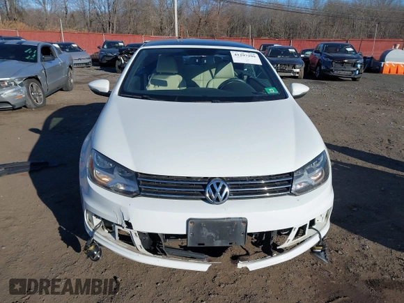 2015 Volkswagen Eos Komfort with VIN WVWBW8AH0FV001011, listed as a IAAI auction lot 41297299 with 81,444 mi miles and . Bid and sale history available at DreamBid. Image 12.
