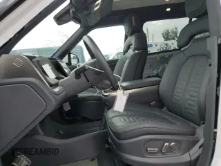 2023 Rivian R1S Adventure z VIN 7PDSGABA7PN021756, wystawiony jako Copart lot #67650414 z przebiegiem 3284 mil mil oraz Szkody całkowita. Historia ofert i sprzedaży dostępna na DreamBid. Obrazek 7.